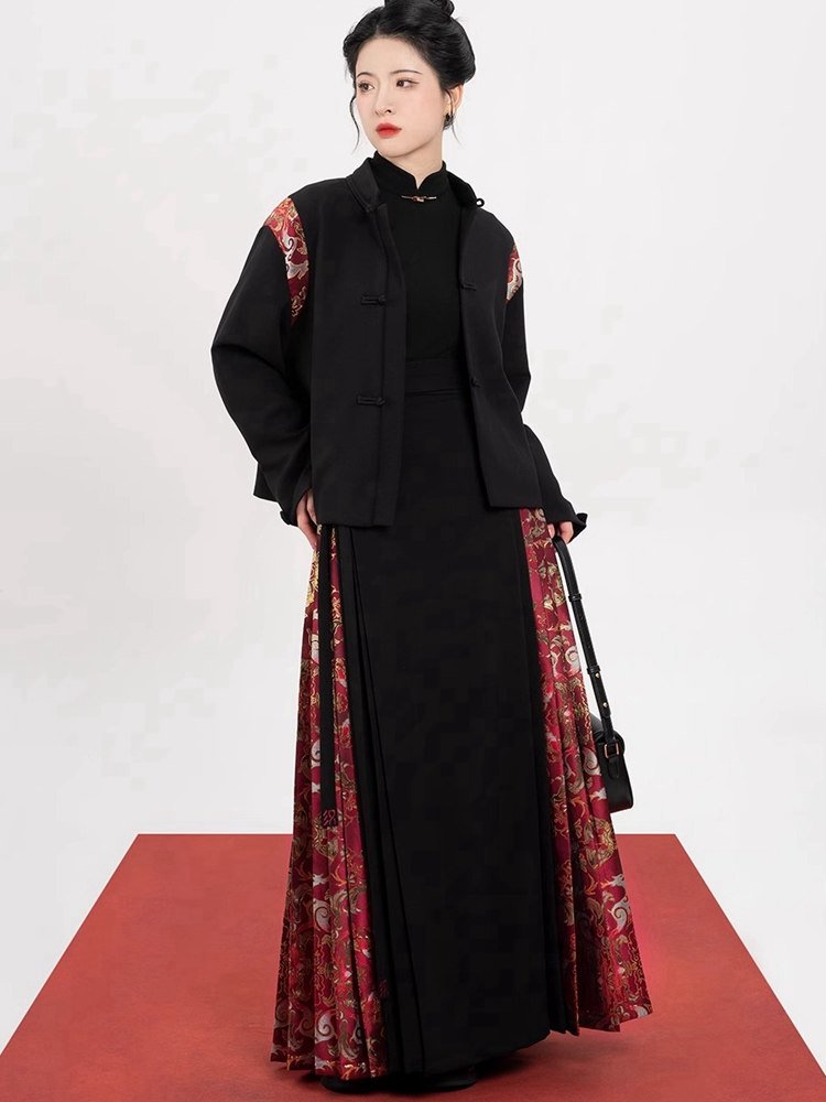 Model posing in black Ma Mian skirt with red brocade embellishment