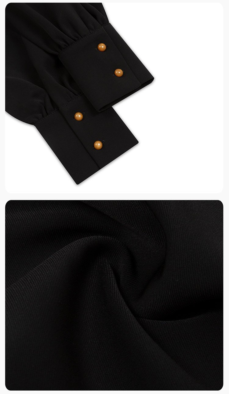Close-up of black suit-like fabric and button craftsmanship.