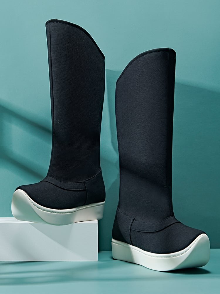 Black canvas Hanfu boots for men showing the tall boot shaft and thick white outsole, designed for traditional Chinese outfits and cosplay styling.