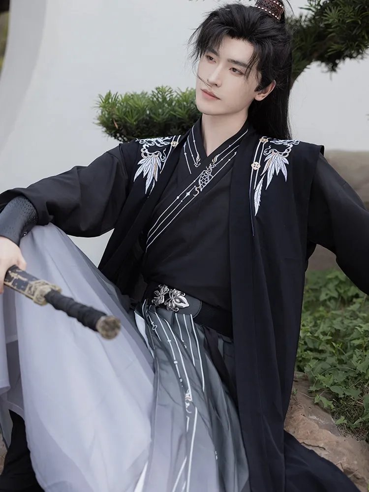 Model wearing black chiffon Hanfu robe for men, elegant traditional Chinese outfit.
