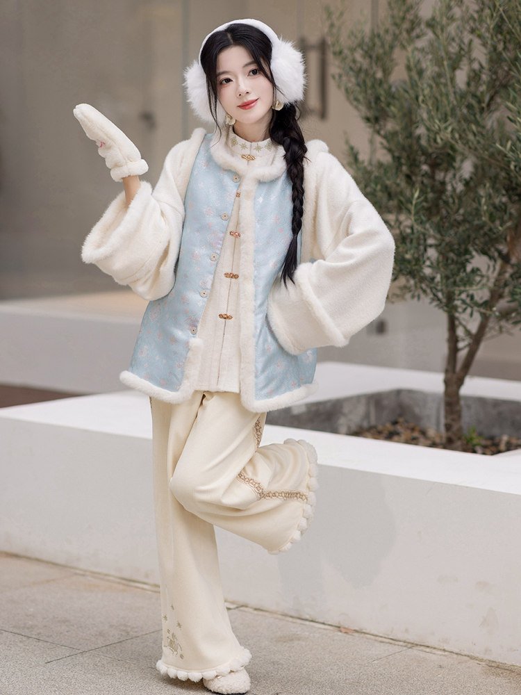 Model walking in full blue vest outfit
