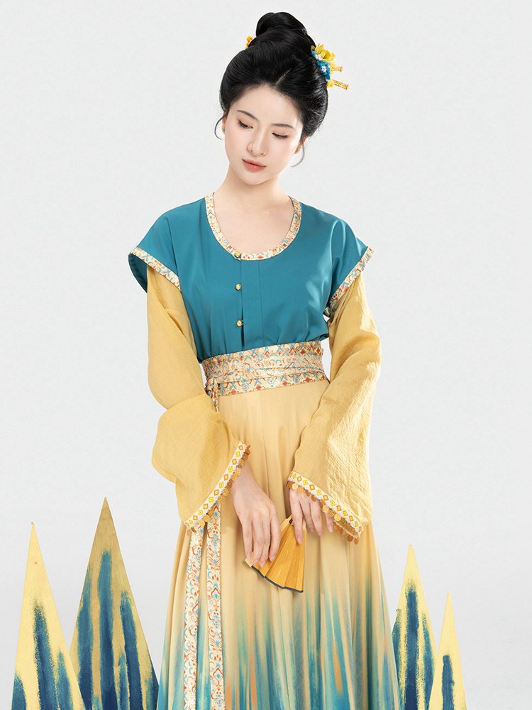 Model wearing Tang style ethnic Hanfu with blue and gold gradient skirt front view