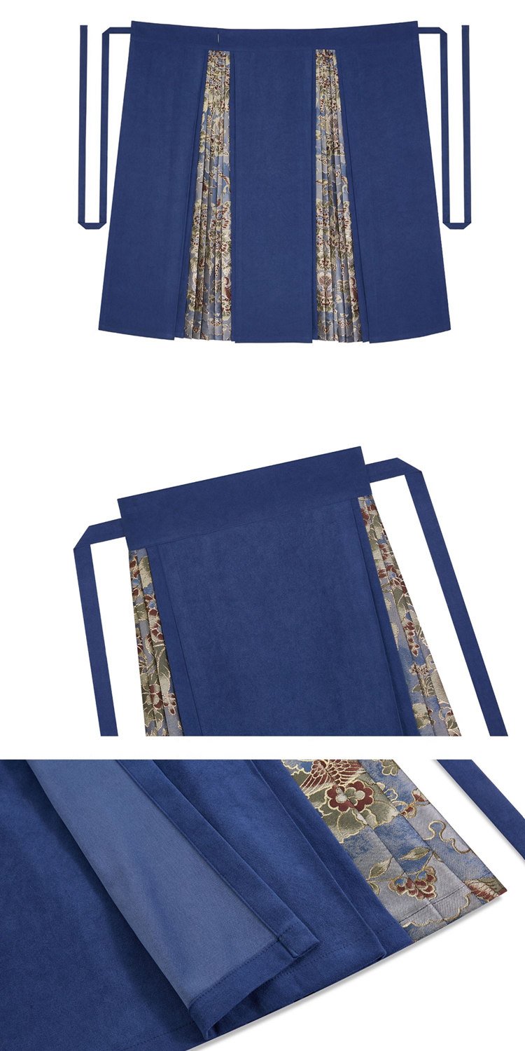 Detail view of the skirt’s brocade panel construction and pleated structure