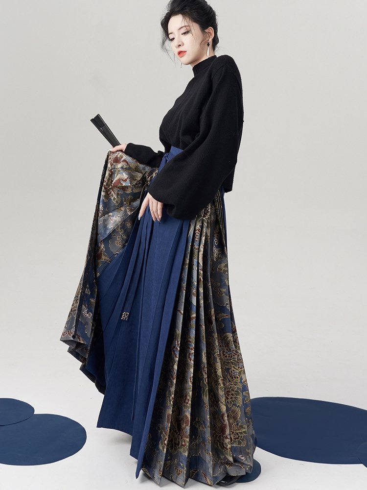Model pairing the blue brocade Ma Mian skirt with a black top