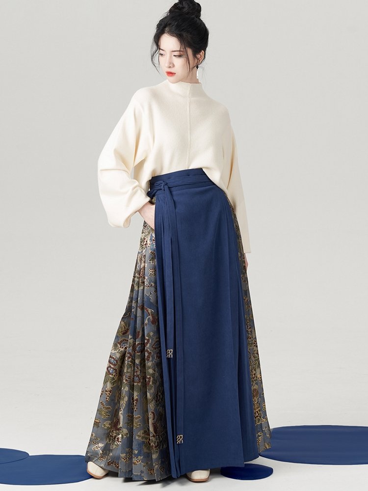 Model styling blue Ma Mian skirt with cream knitted winter top