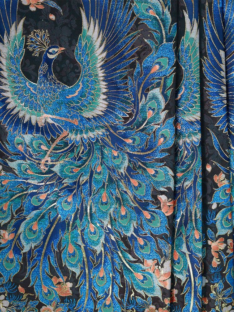 Close-up of peacock feather brocade pattern with blue and gold silk shine