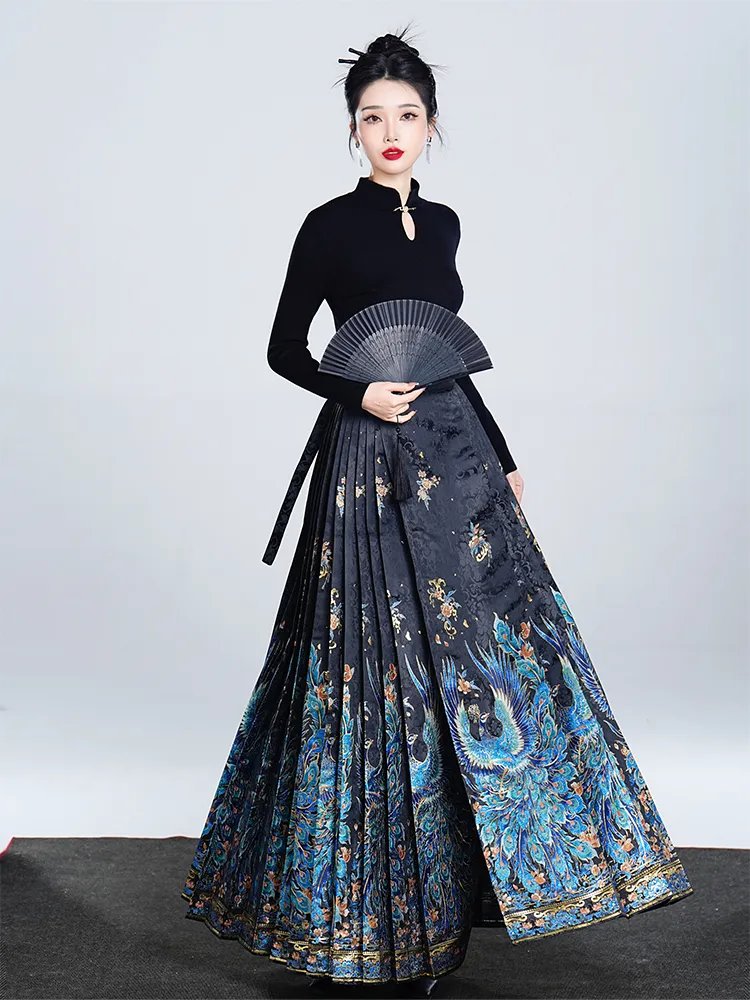 Model wearing a blue peacock brocade Ma Mian skirt with shimmering gold details