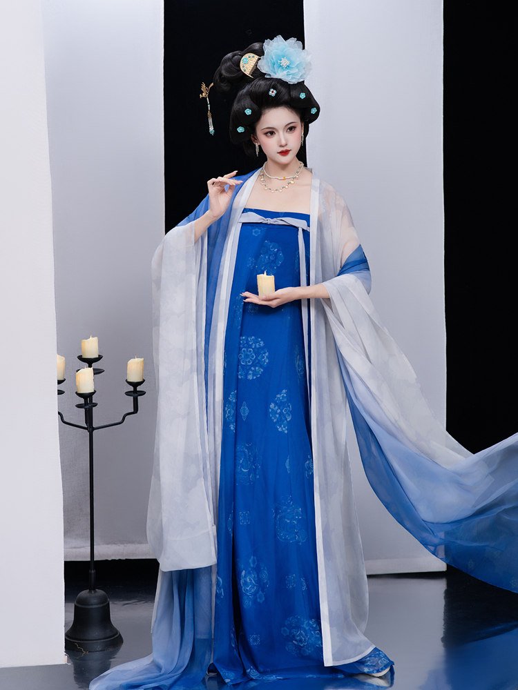 Blue Tang dynasty ruqun dress with white chiffon shawl, sleeves extended in a dynamic pose.