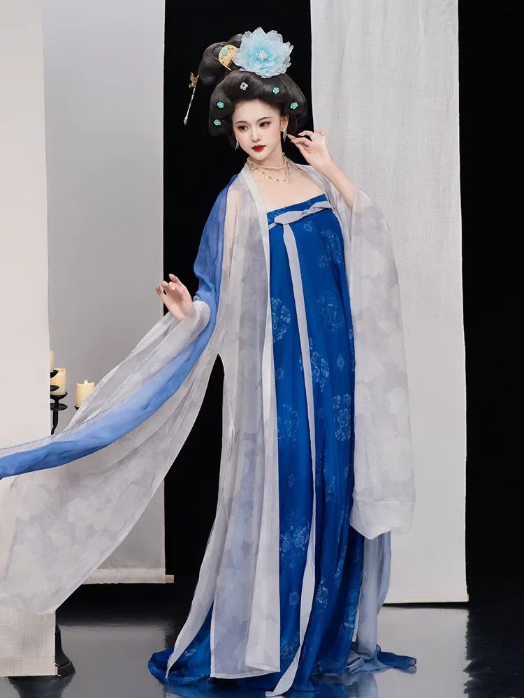 Wide sleeves of blue Tang style Hanfu dress extended to display the flowing snow-gauze fabric.