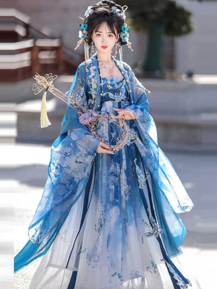 Model wearing blue butterfly embroidered Hanfu dress, front view with flowing chiffon sleeves.