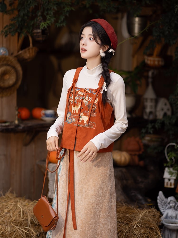 Side view of winter Hanfu outfit with orange vest and beige skirt