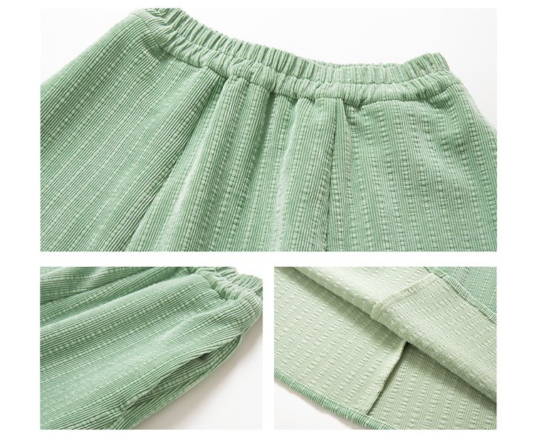 Close-up of ribbed corduroy fabric showing texture and fine stitching.