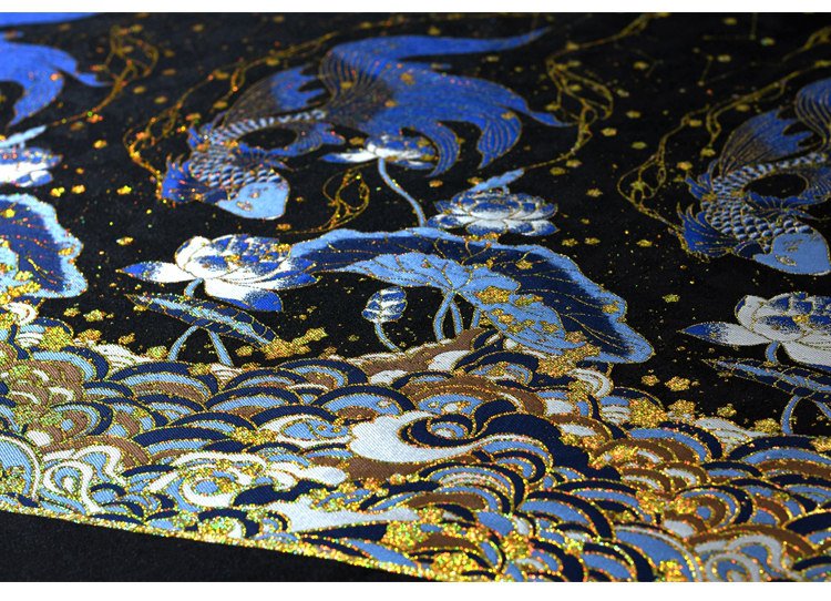 Embroidered blue dragon and wave patterns with metallic gold highlights