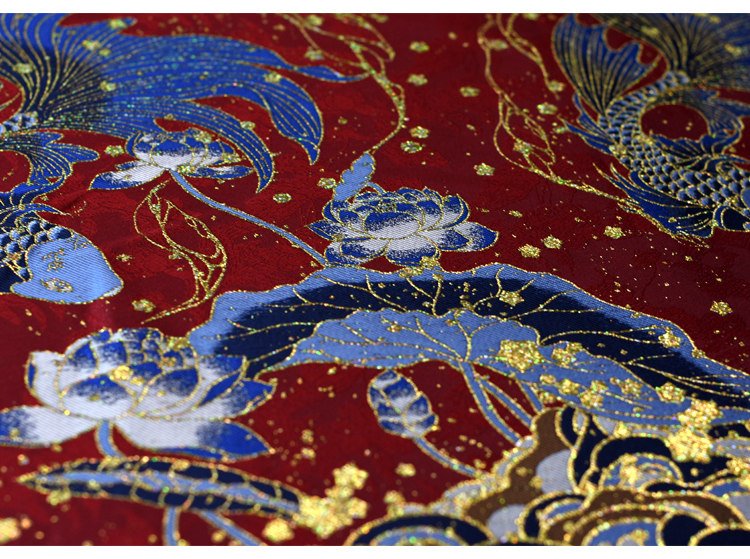 Red embroidered dragon and wave patterns in red and gold