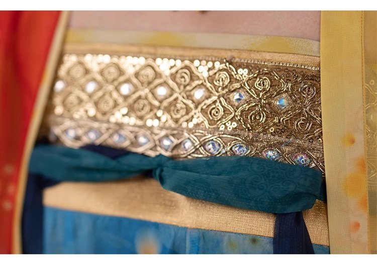 Close-up of embroidered gold chest trim on a Dunhuang Tang-style hanfu dress.