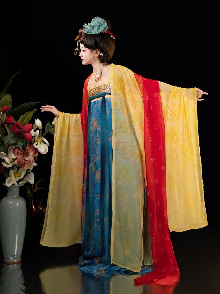 Side view of the Dunhuang Tang-style hanfu dress with layered red and yellow chiffon sleeves.