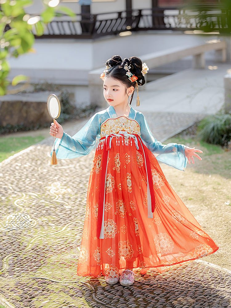 Girl posing outdoors in a blue and red Dunhuang princess dress