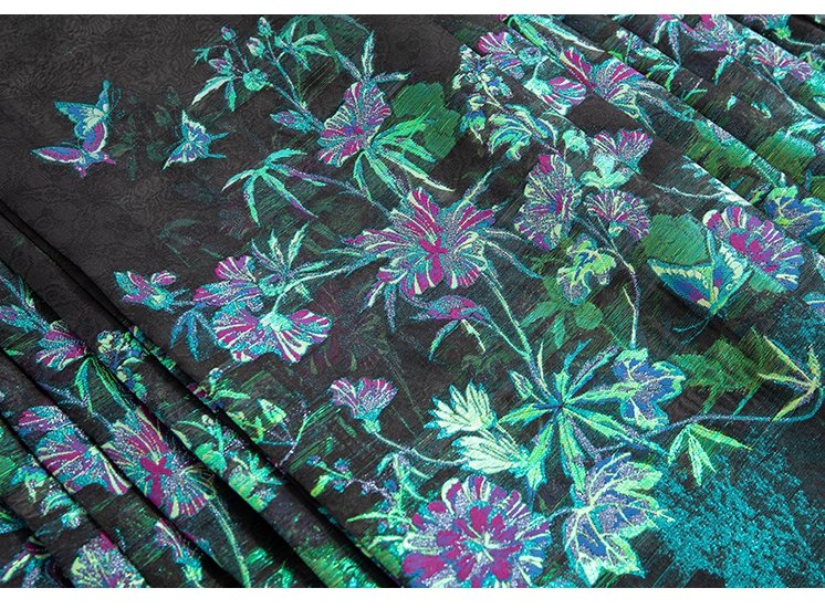 Jacquard fabric with turquoise and violet floral embroidery