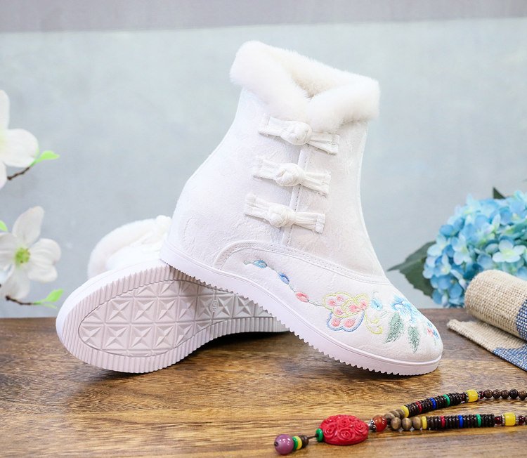 Display of white embroidered Hanfu boots