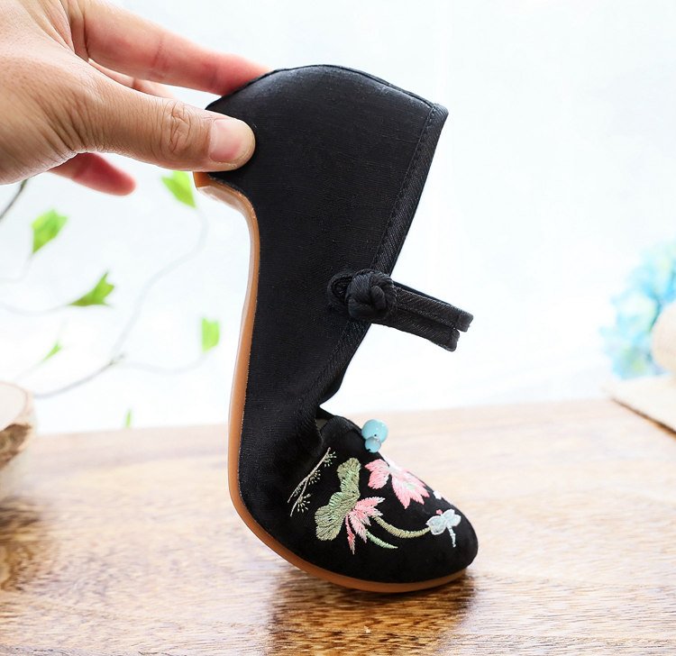 Black embroidered Mary Jane pumps with low heel