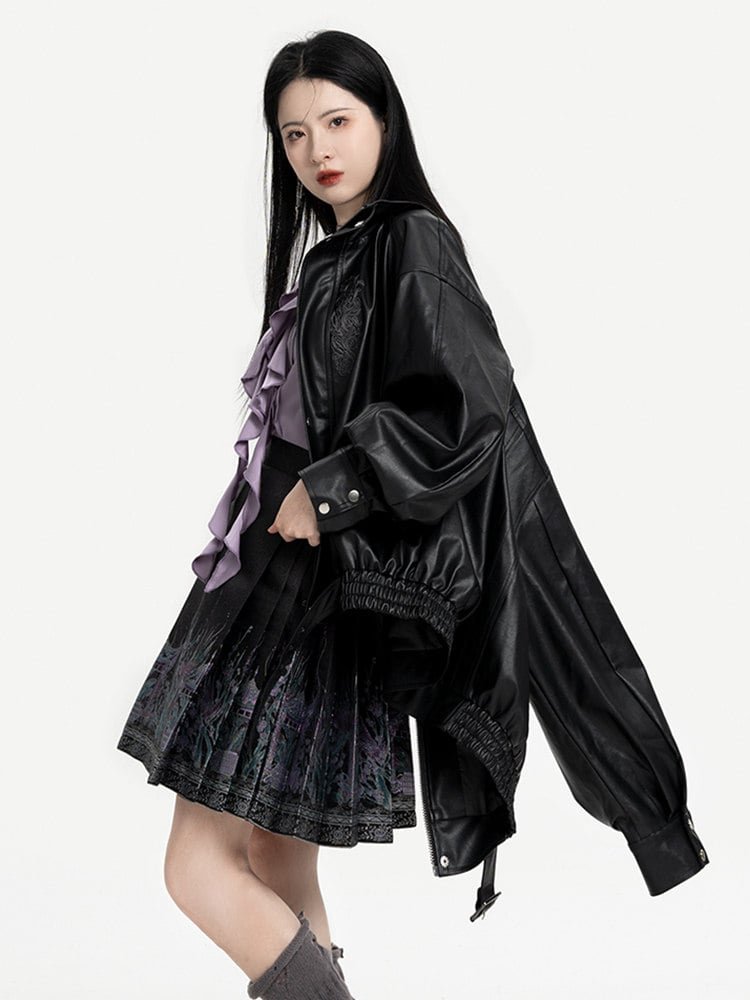 Side-back view of leather jacket and short embroidered mamian skirt.