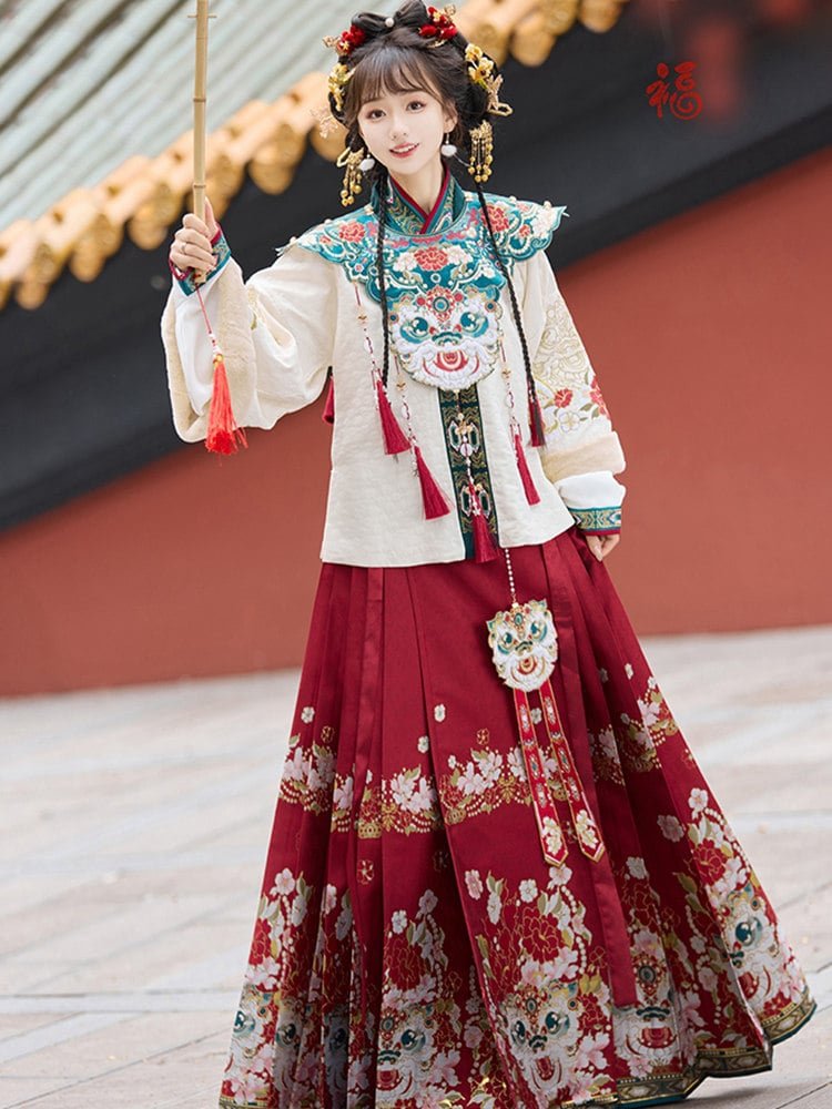 Red and green embroidered Hanfu sets on display