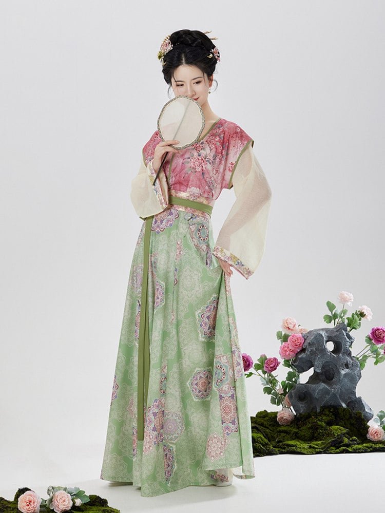 Side view of woman in Tang-style Hanfu with pink Beizi and pastel green floral skirt