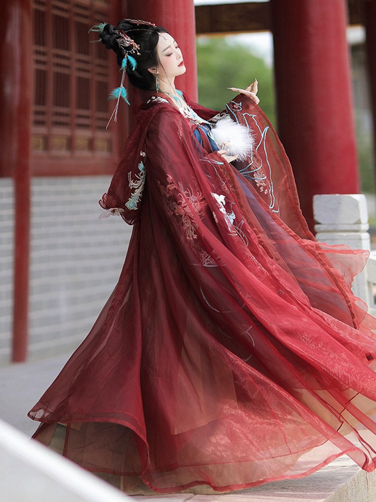 Elegant side view of Tang-style embroidered gown