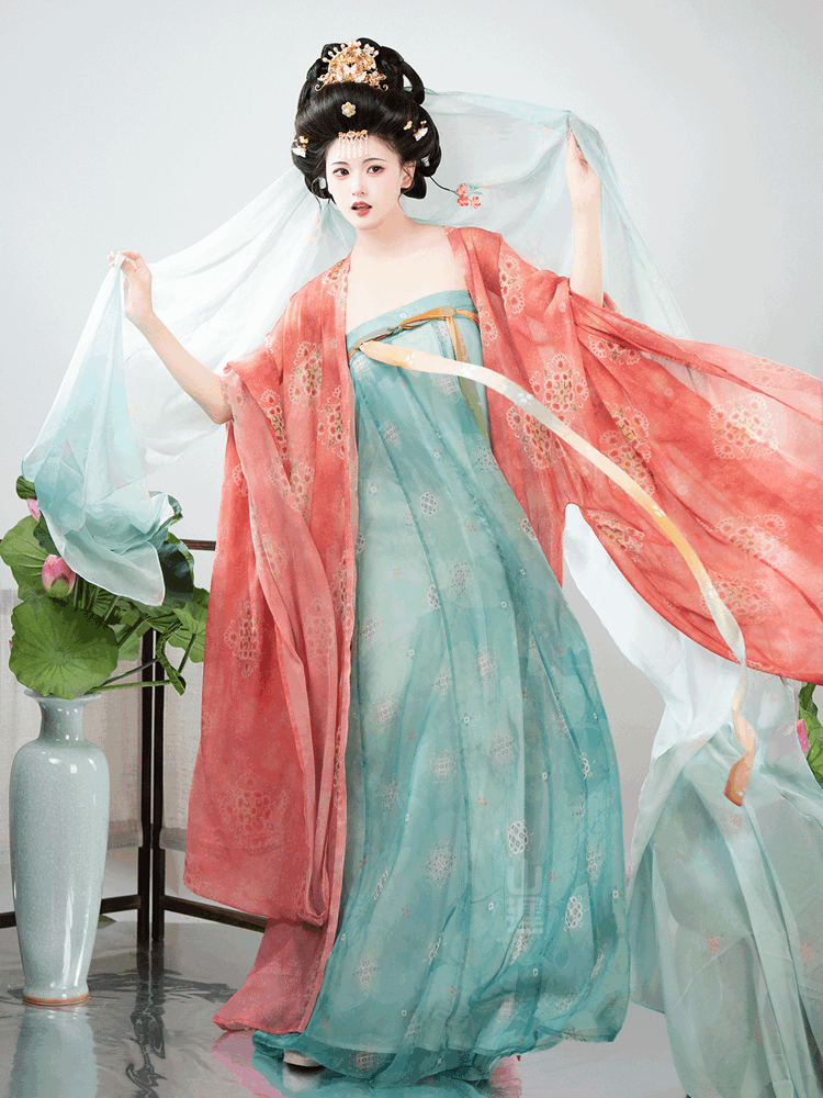 Model posing with extended chiffon shawl in soft motion, showing full Tang style outfit.