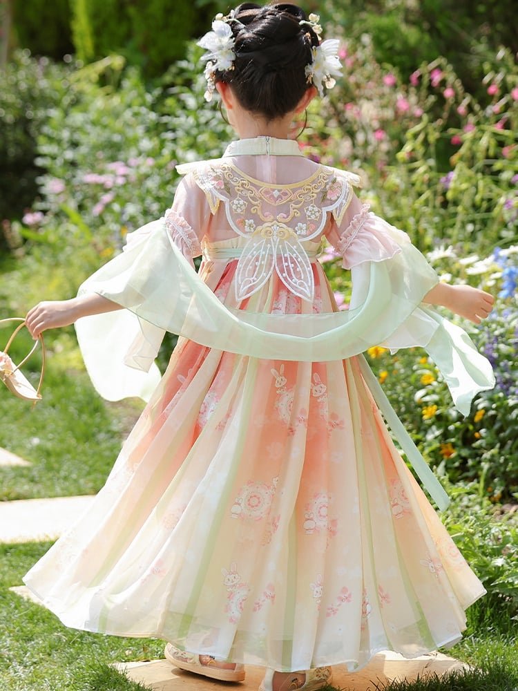 Back view of a girls Hanfu dress showing intricate embroidery and butterfly bow
