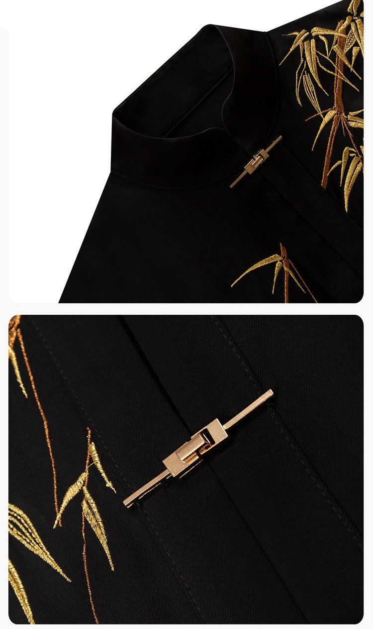 Close-up of coat embroidery, metal clasp, and bamboo pattern.