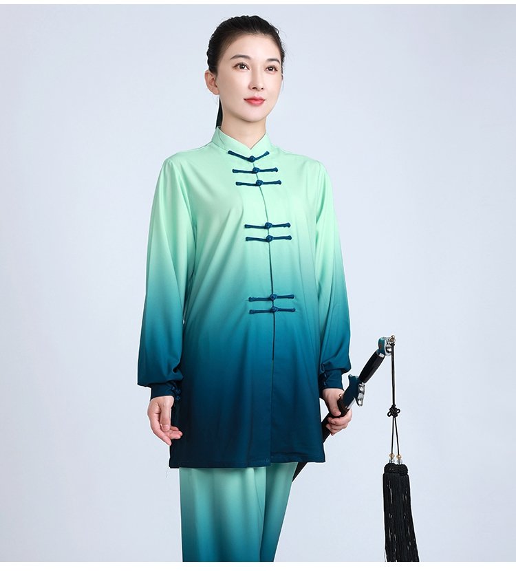 Side view of woman in gradient Tai Chi outfit holding fan