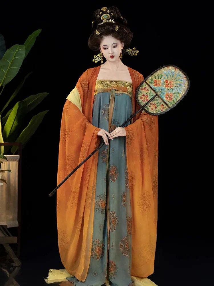 Model holding traditional fan while wearing gradient Tang style Hanfu dress