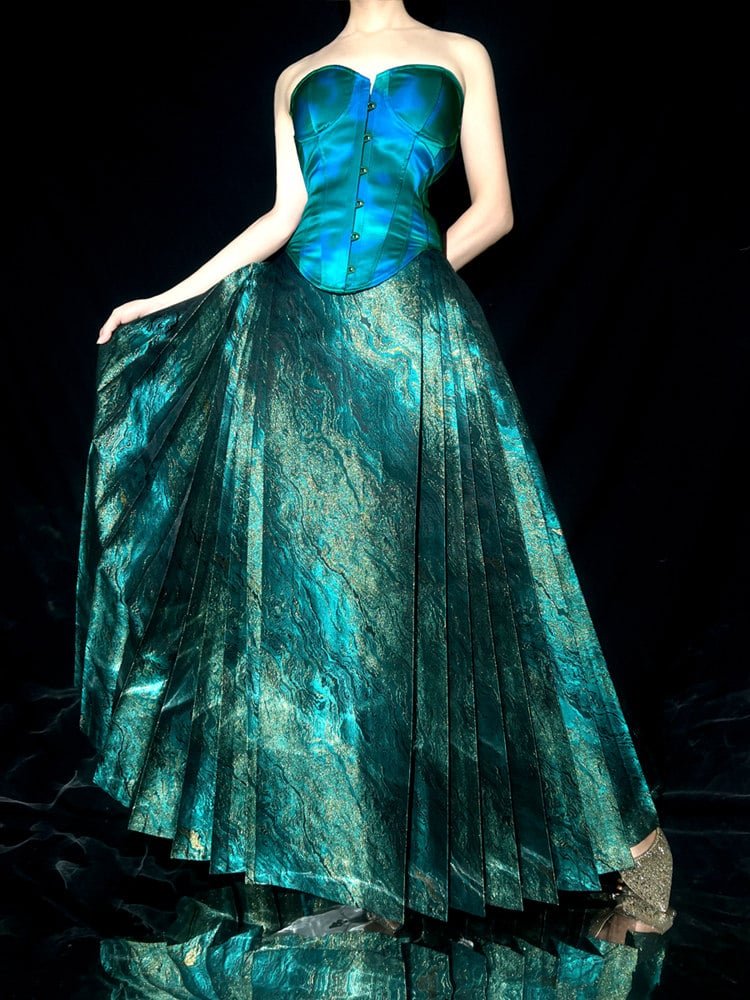Mamian skirt captured in mid-movement showing wide pleats