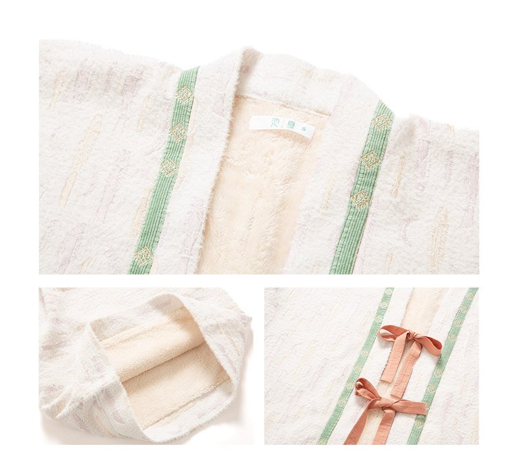 Close-up of fleece jacket lining and green embroidered hem.
