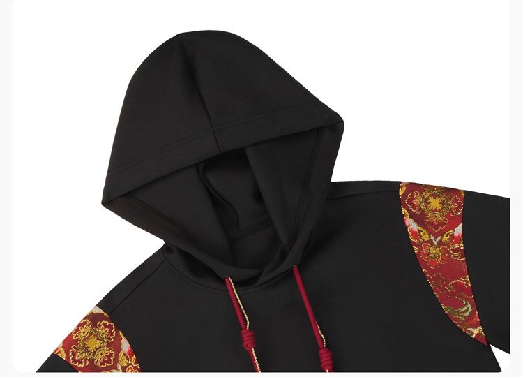 Hood detail showing red brocade trim on black Hanfu hoodie