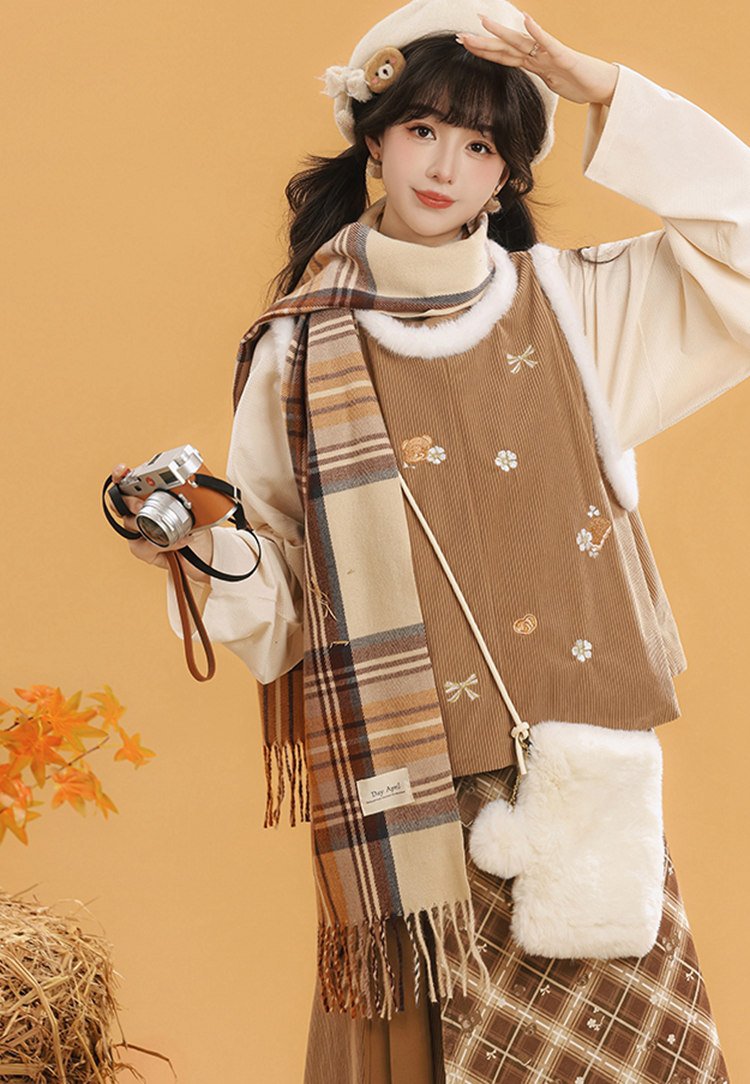 Hanfu-inspired brown winter outfit paired with a scarf and fluffy accessories