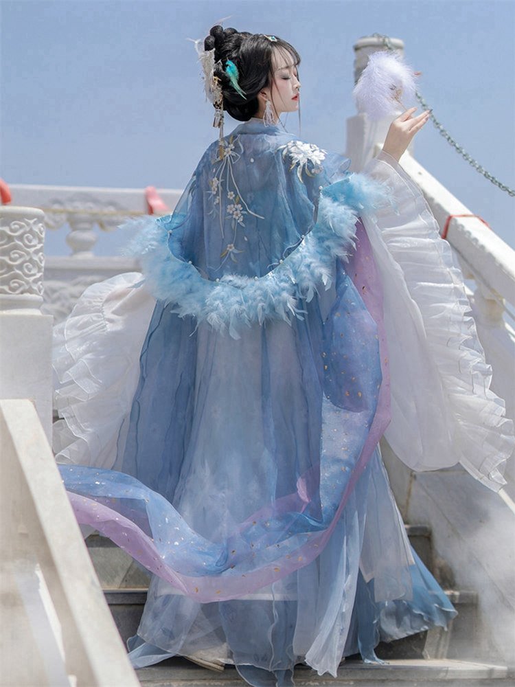 Back design of embroidered feather cape in blue costume