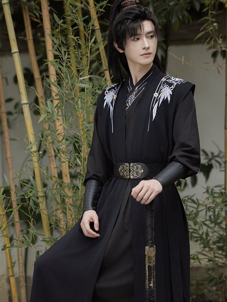 Model wearing black Hanfu robe for men in bamboo forest, showing Tang-Song elegance.