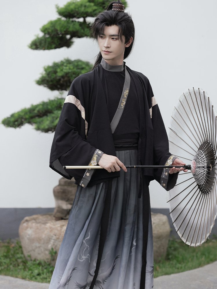 Model in black chiffon Jin-style Hanfu for men, holding umbrella, elegant Chinese outfit.