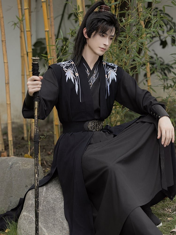 Seated view of black chiffon Hanfu robe for men, elegant and confident.