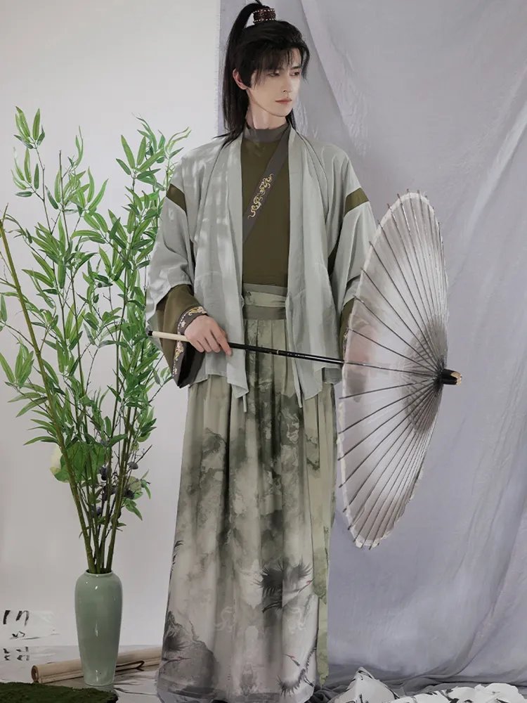 Light green chiffon Jin-style Hanfu set for men, soft ink-print skirt and flowy sleeves.