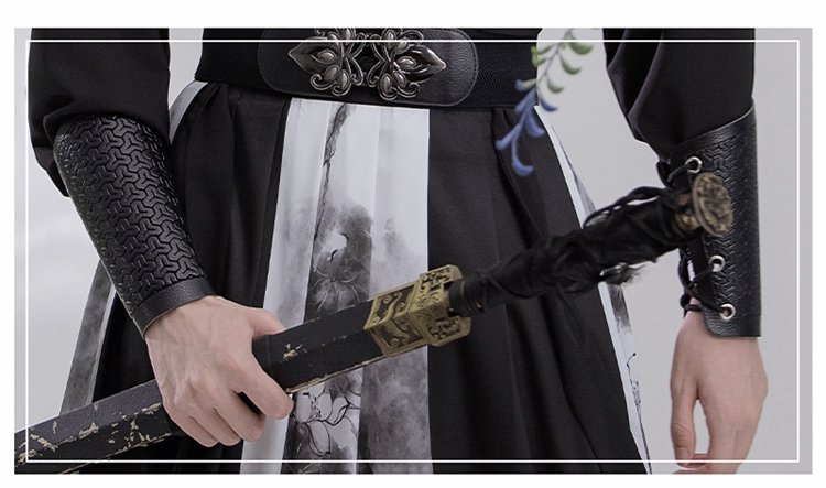 Faux-leather cuff detail with embossed texture on black Hanfu robe for men.