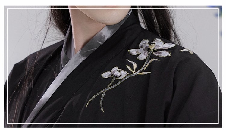 Shoulder embroidery detail on black Song-style Hanfu robe for men, floral pattern.