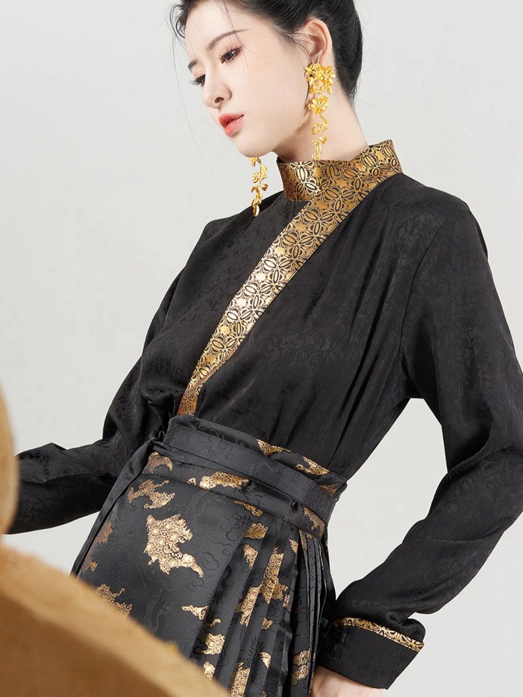 Black curved-collar Hanfu top with gold brocade trim inspired by ancient bronze patterns