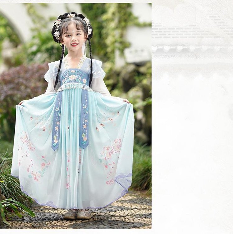Smiling girl in blue Hanfu with open arms