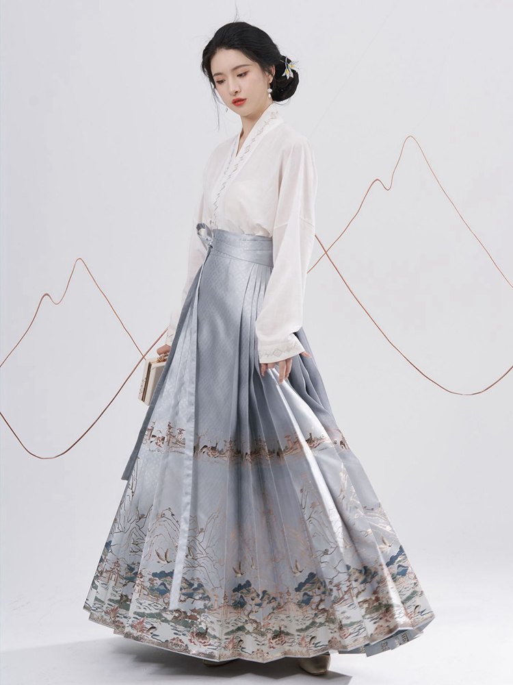 Model showing back angle of the blue landscape brocade Ma Mian skirt