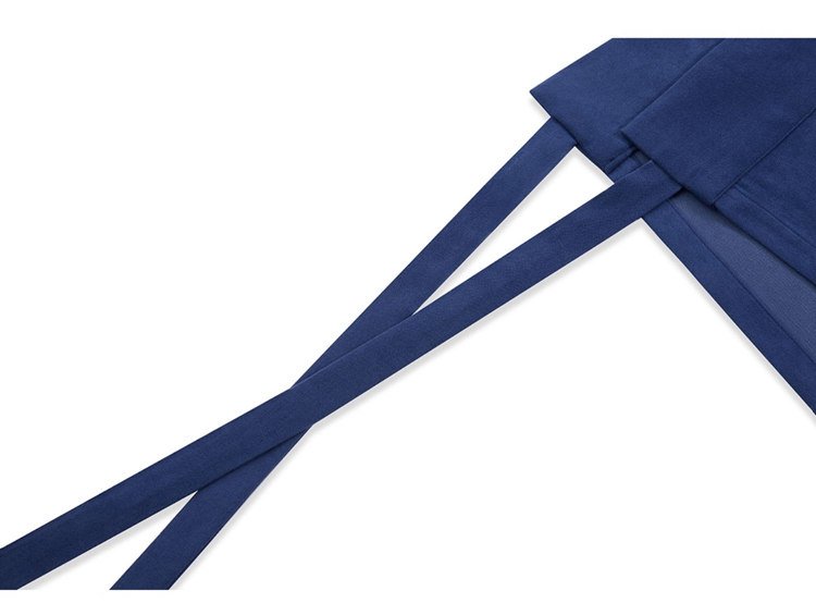 Close-up of Ma Mian skirt waistband ties in blue fabric