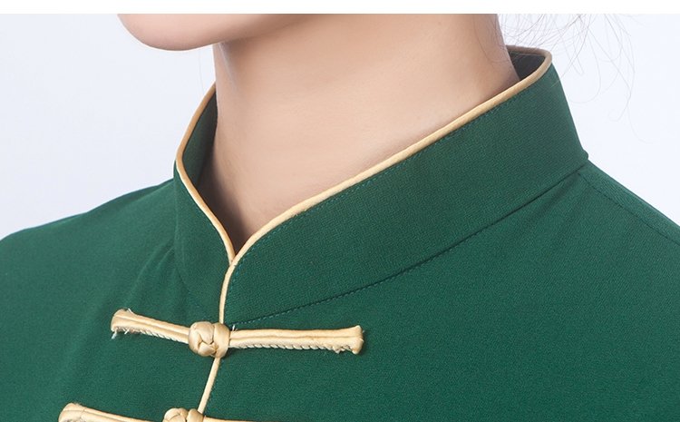 Close-up of Mandarin collar and gold button design