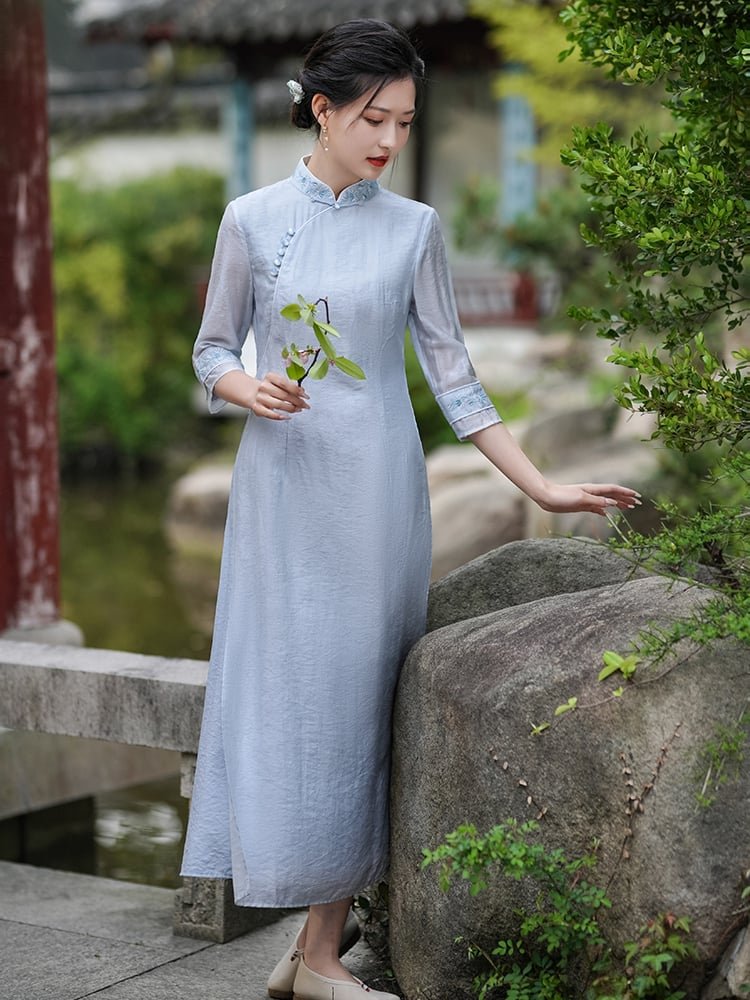 Woman wearing Mandarin Collar Hanfu Dress in garden scene